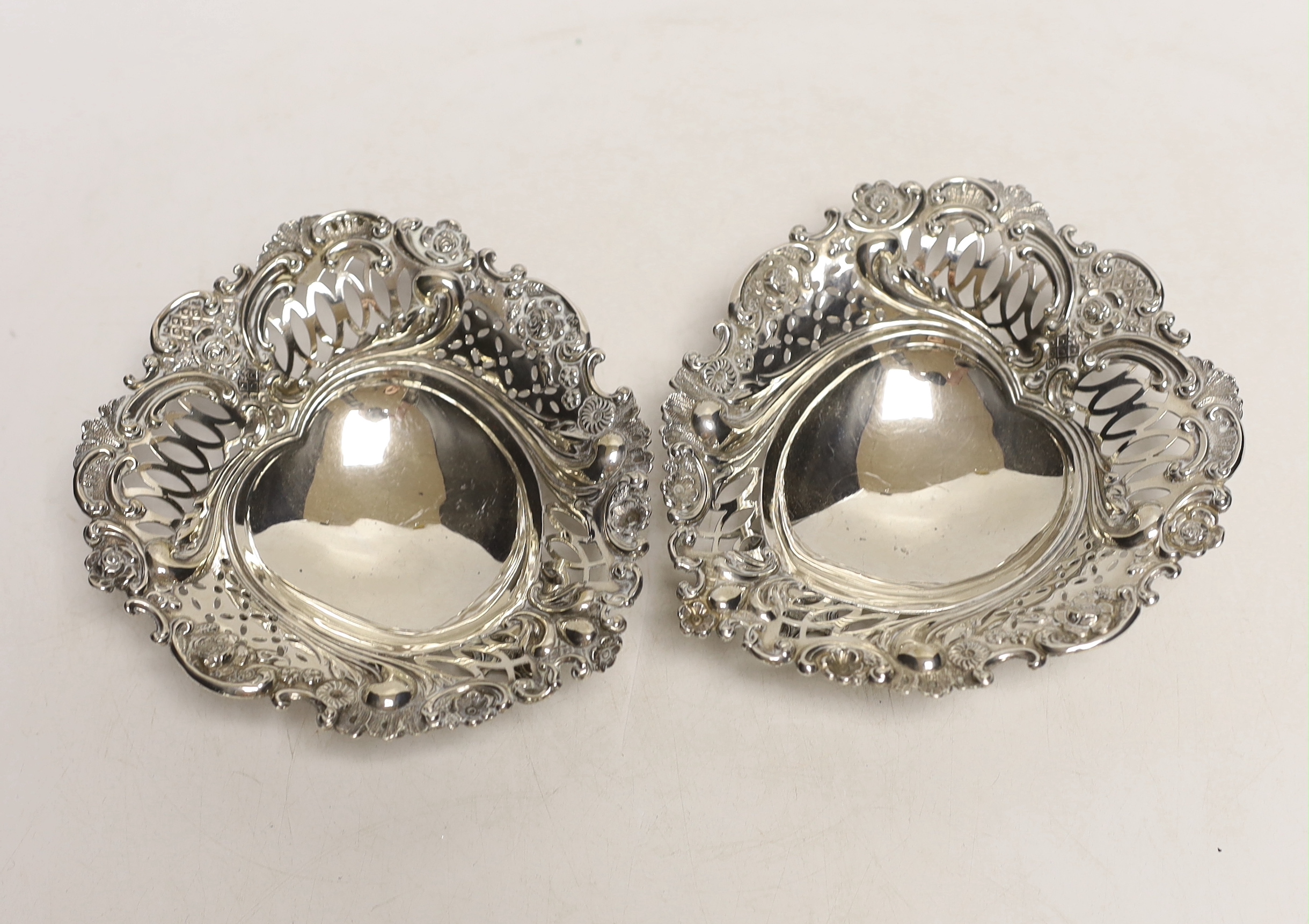 A pair of late Victorian Scottish pierced silver bonbon dishes, Hamilton & Inches, Edinburgh, 1893, 13.2cm, 6.5oz.